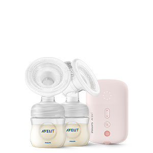 eine Milchpumpe und eine rosa Schachtel