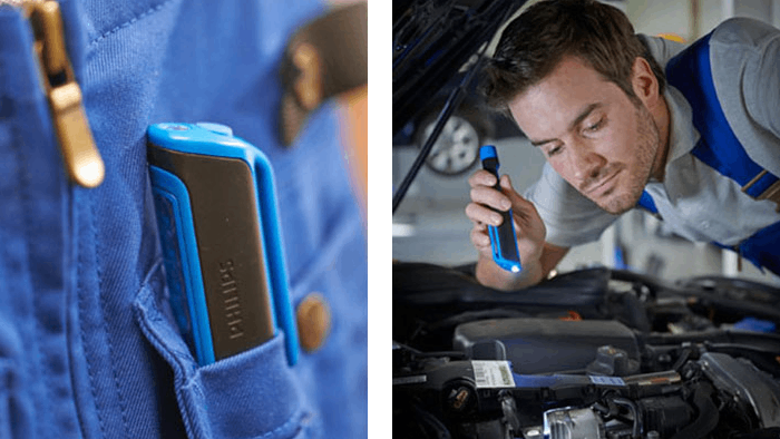 Personne examinant le moteur d'une voiture &agrave; l'aide d'une lampe stylo LED Philips 