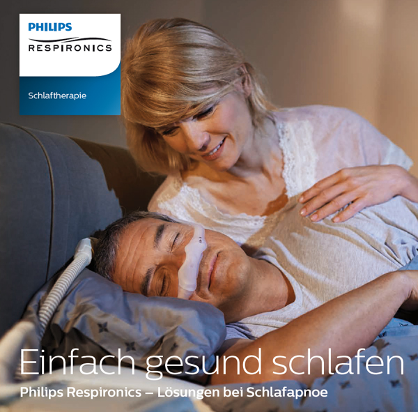 eine Frau, die einen Mann im Bett hält
